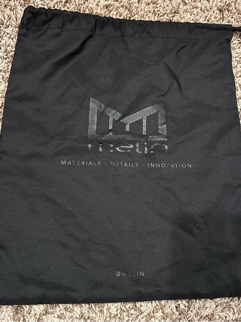 Melin Black Drawstring Hat Sleeve Bag